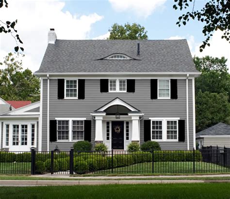 white house with grey metal.roof and.wood shutters|gray house what color shutters.